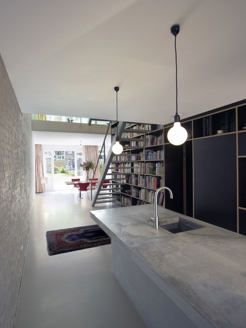 Narrow kitchen design by Shift Architecture Urbanism with Cement Countertop