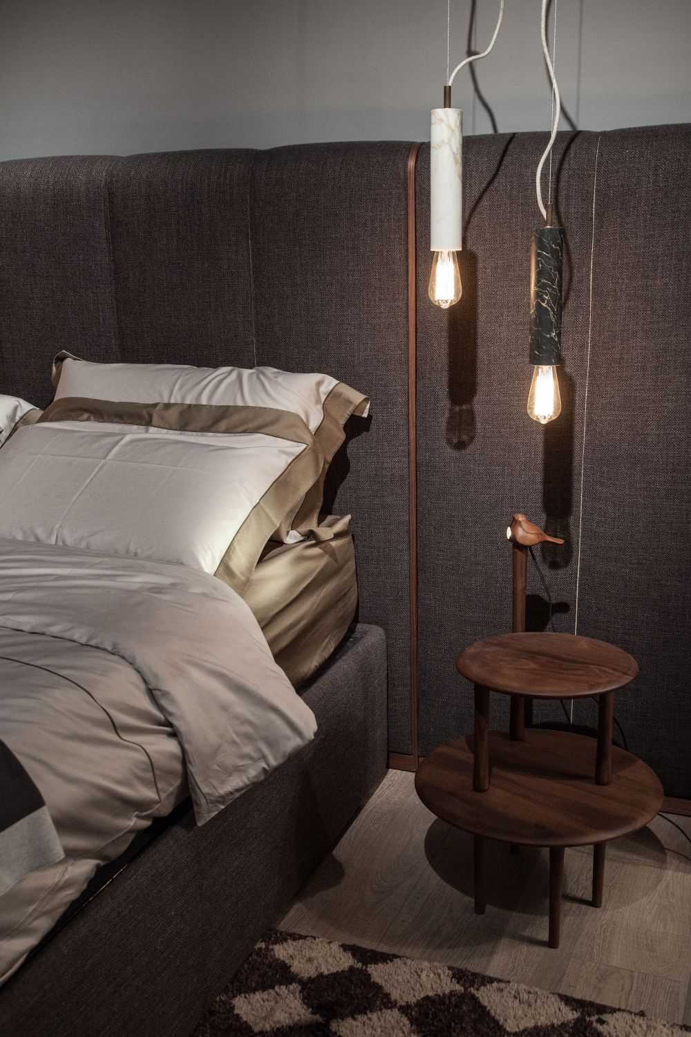 Nesting tables and hanging lamps over them used like bedside tables