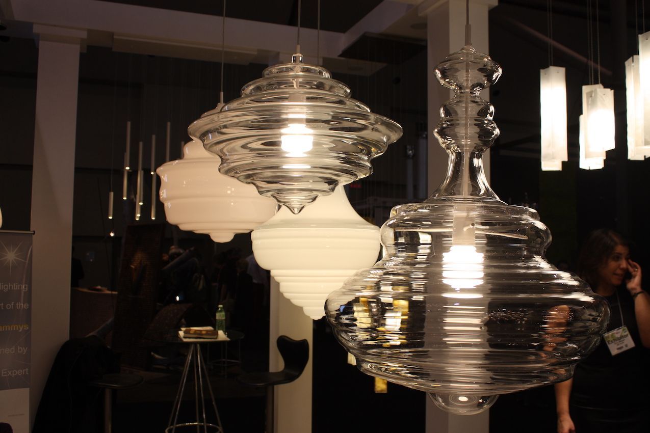 From AM Lighting, these pendants in the Neverending Glory collection.  Made from blown glass, they come in clear and white -- perfect for almost any space.