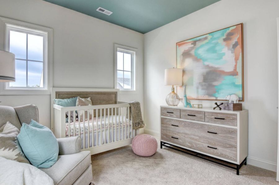 Nursery mid sized transitional gender neutral carpeted and beige floor