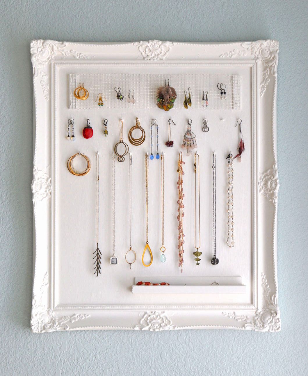 Old picture frame turned into a jewelry holder