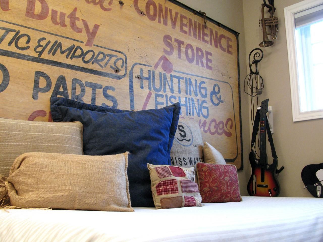 Old sign headboard and different pillows