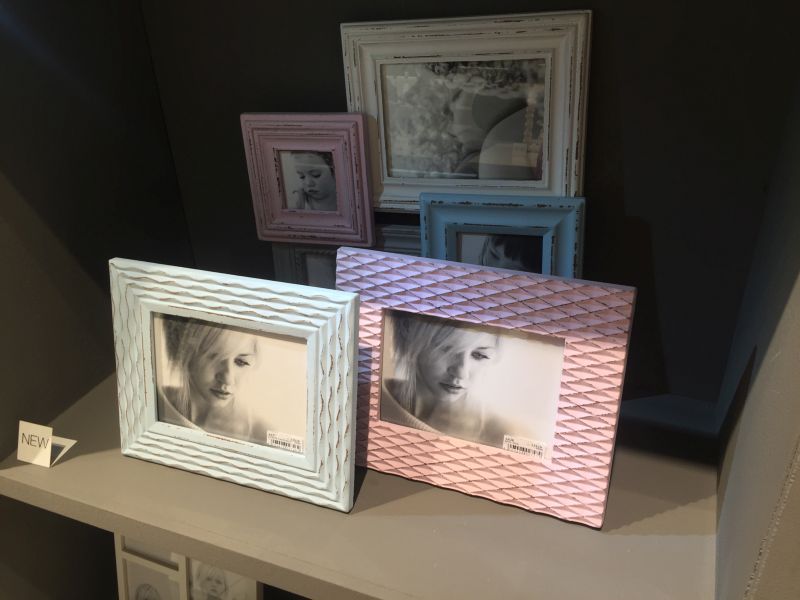 Old style picture frames in pink pale and blue