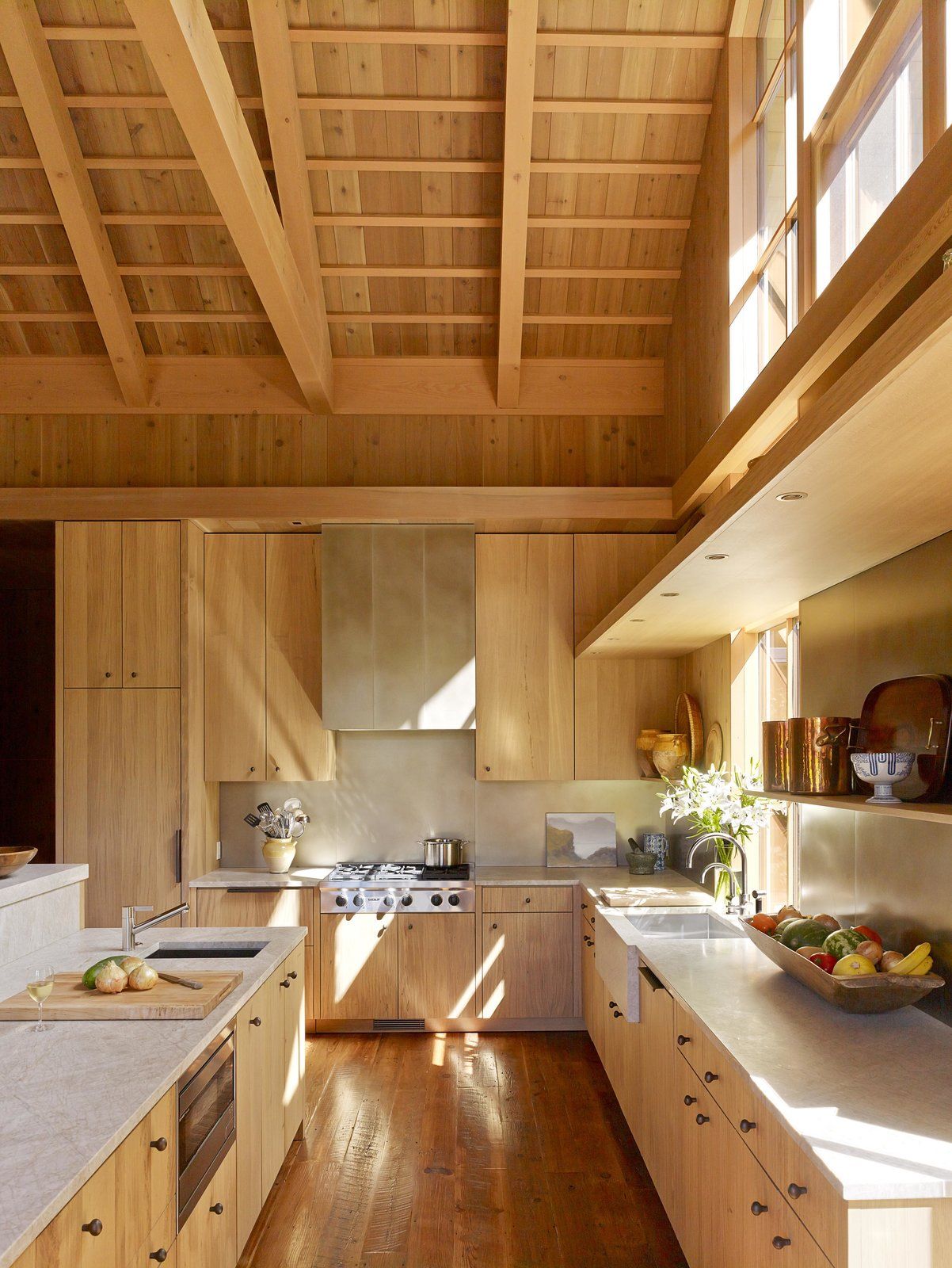 The kitchen maintains the rustic, natural feeling.