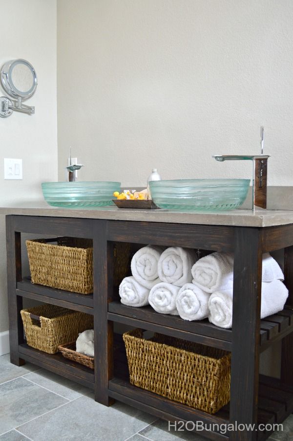 Open shelves bathroom vanity with glass bowl for wash