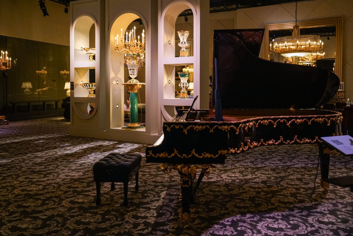Opulent piece of furniture for living room - a piano with gold accents