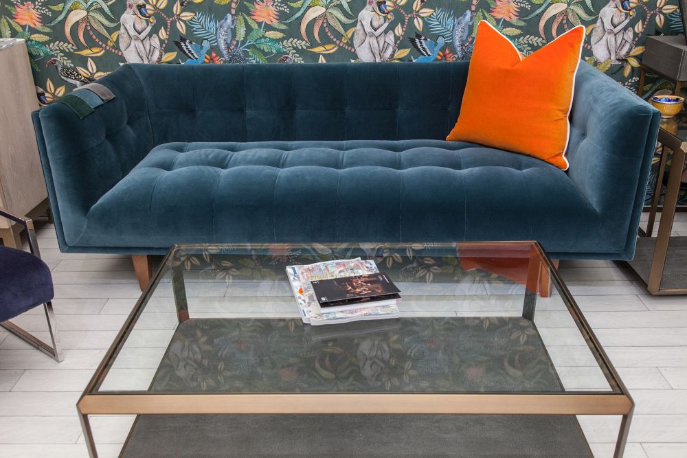 Orange pillow for a modern velvet couch