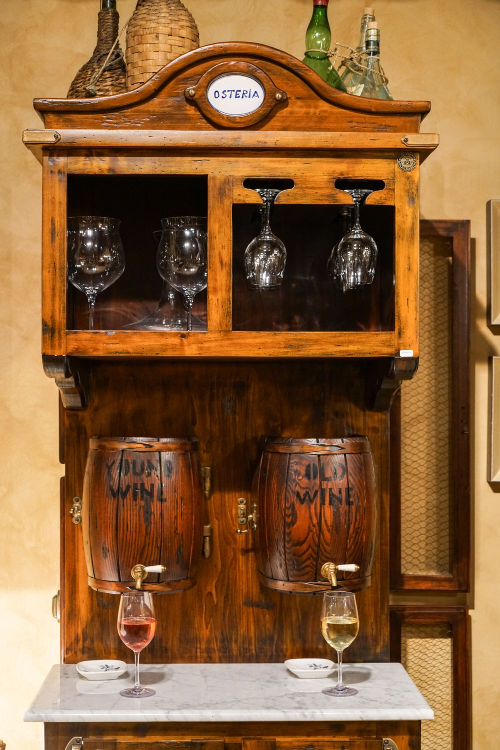 Osteria red and wine machine featuring two small barrels