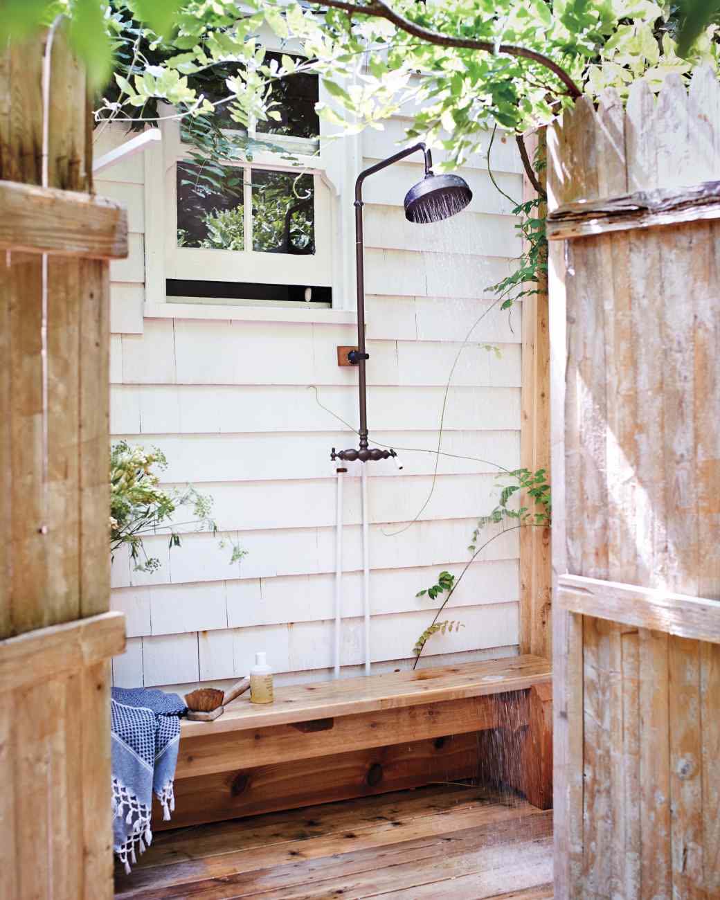 Outdoor shower with a bench