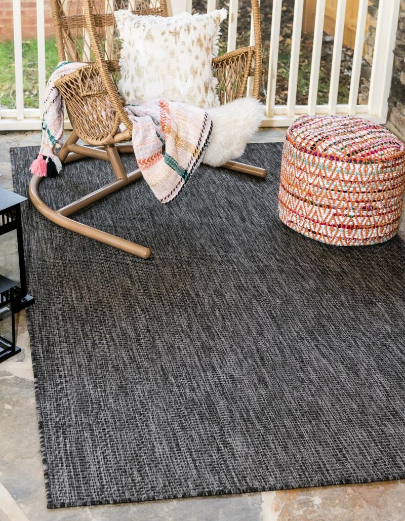 Outdoor solid black and white rug