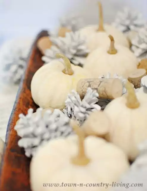 Paint pine cones and create an centerpiece