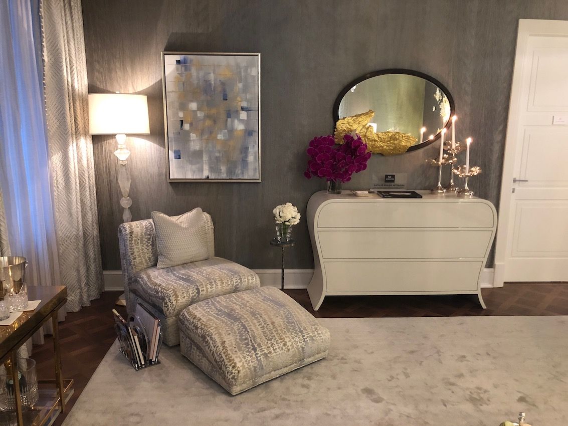 A cozy sitting area in the corner of the room reflects the same level of luxury.