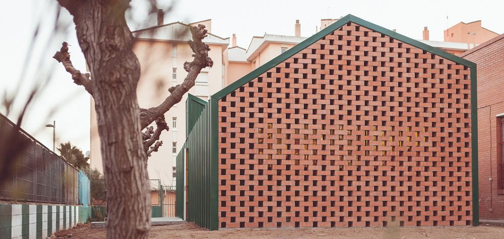 Perforated and stacked bricks facade - NUA Arquitectures