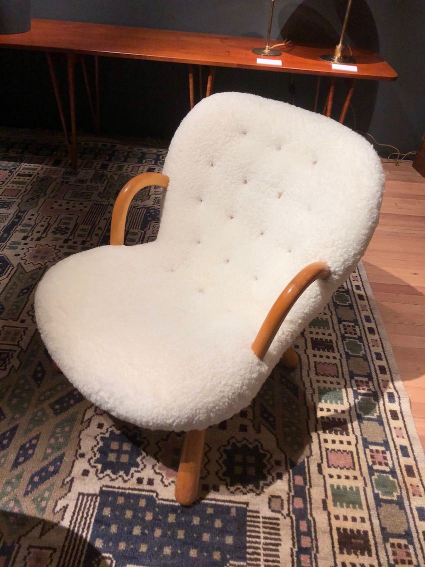 Classic Scandinavian design and sheepskin upholstery add up to a very appealing chair.