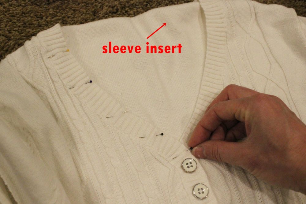 Pin the flattened sleeve to the v-neck