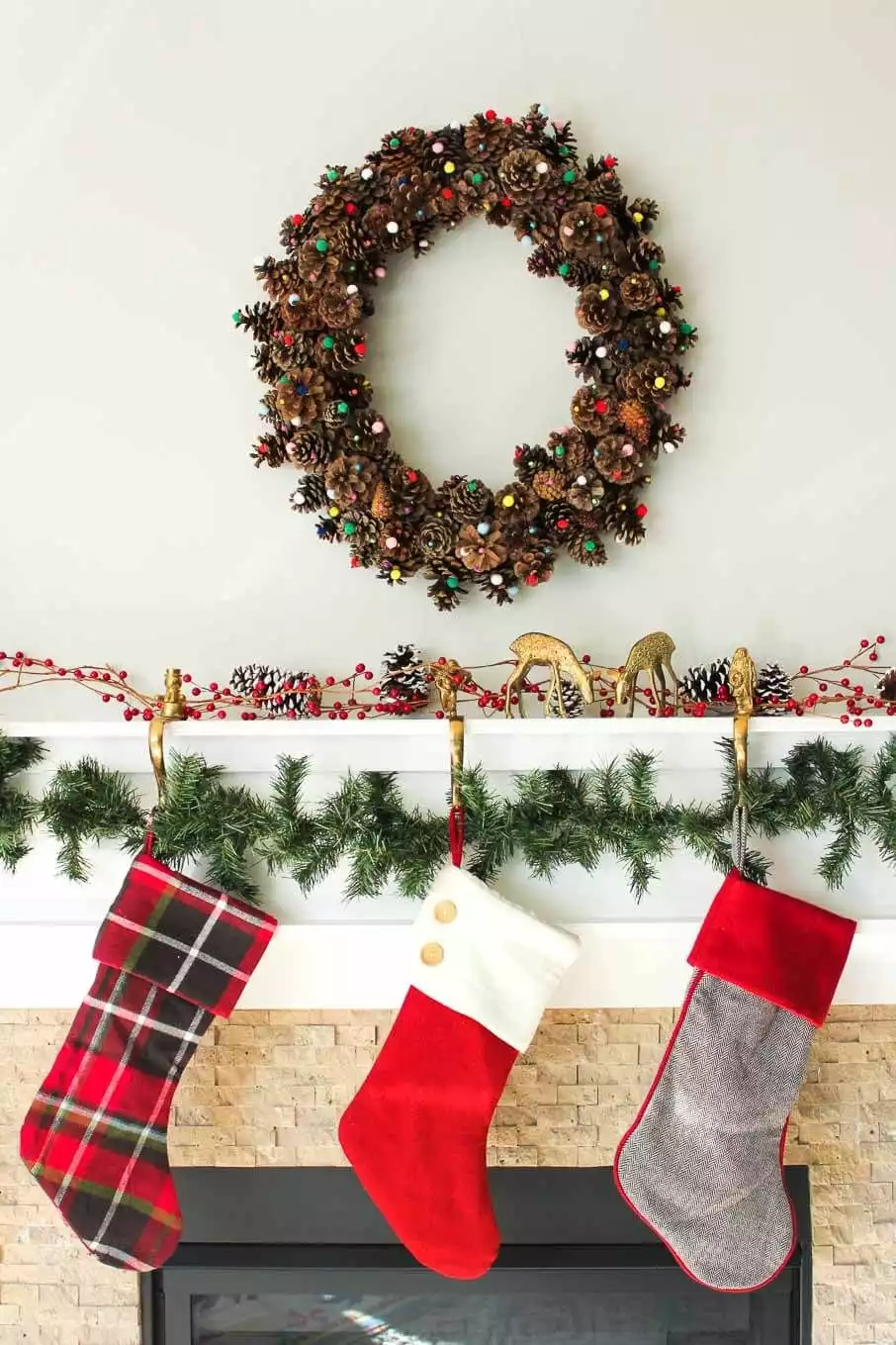 Pinecone wreath above the fireplace