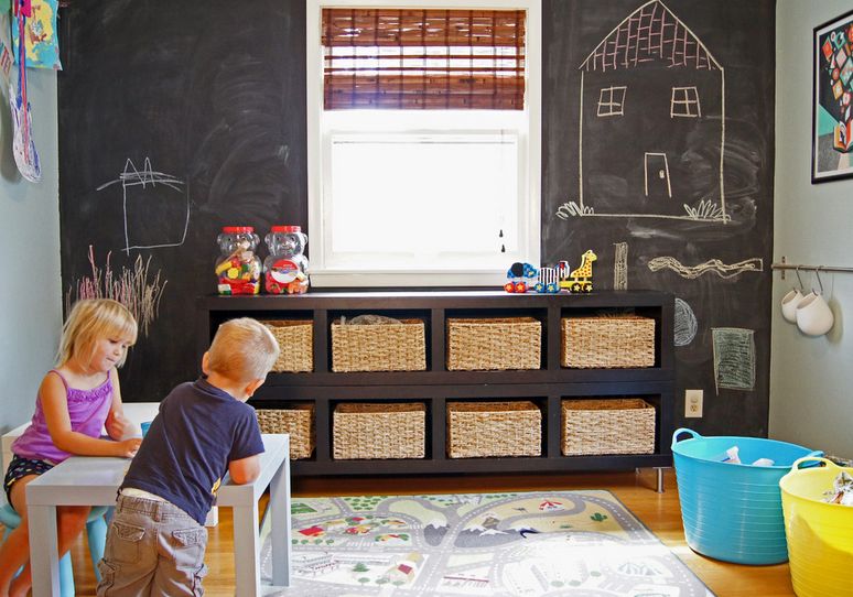 Playroom with chaclboard wall and rattan baskets