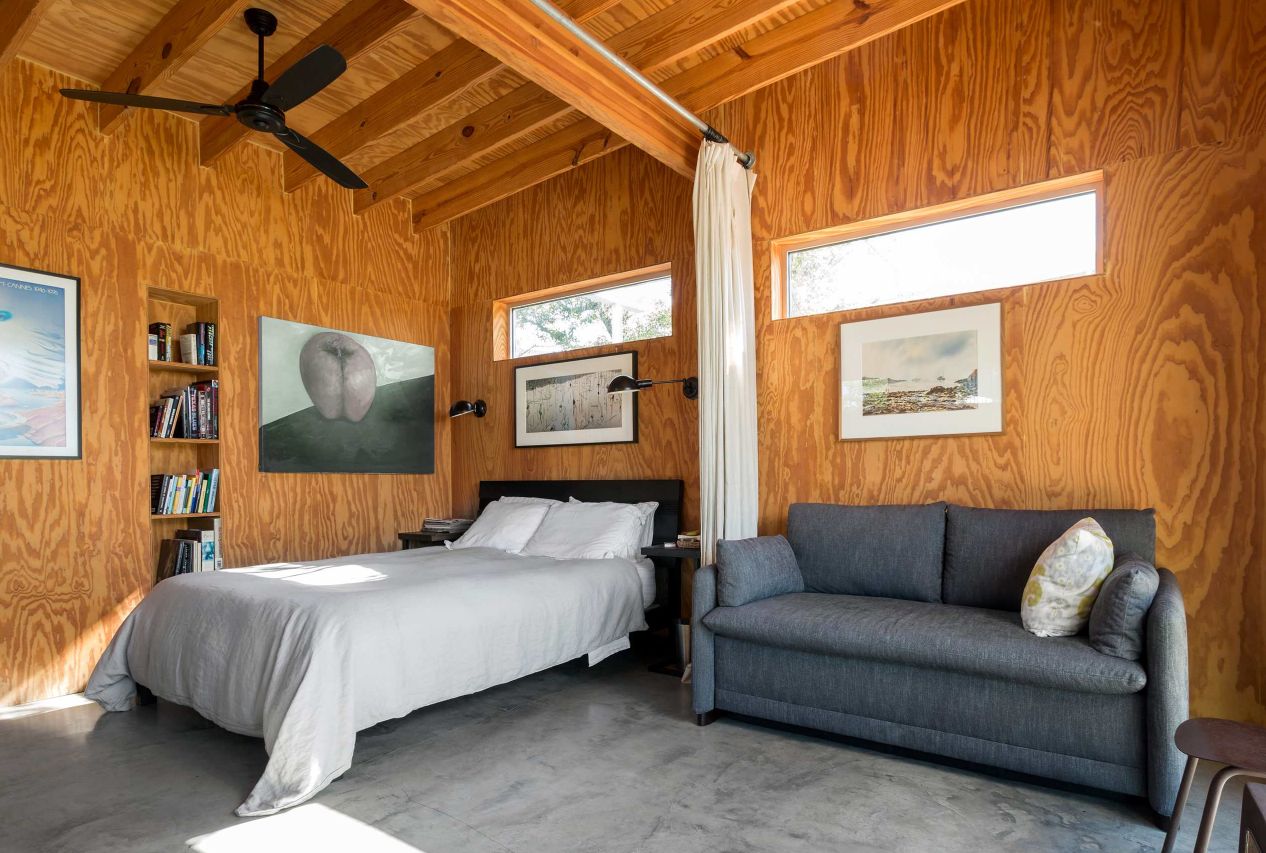 Plywood walls and curtain room divider polished concrete floor