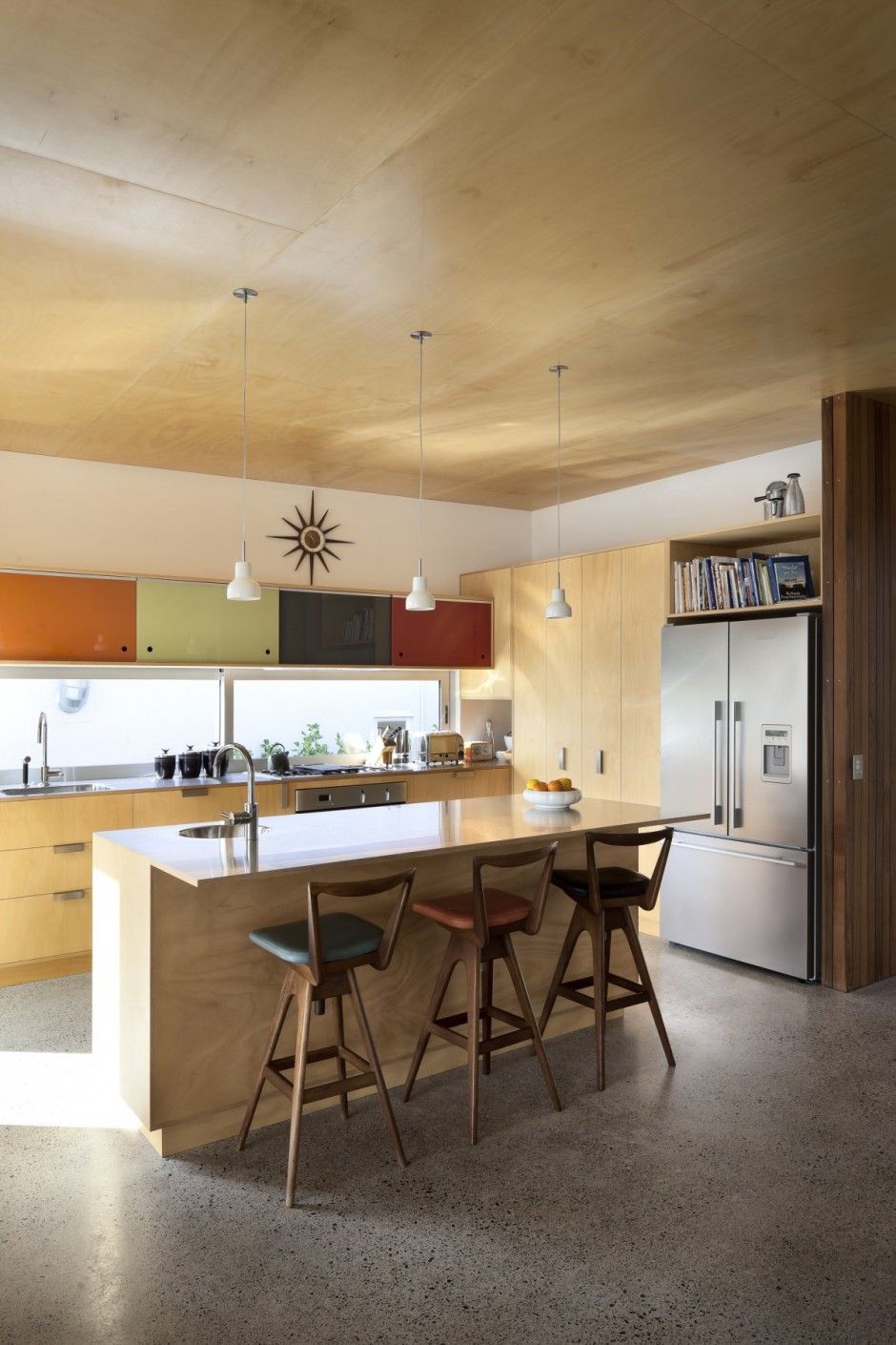 Polished concrete floor for kitchen by Bossley Architects