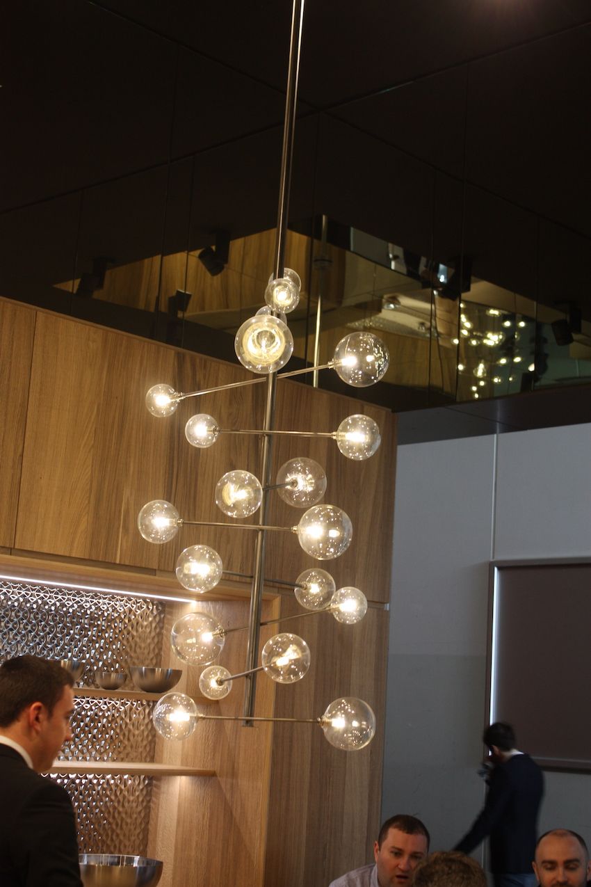 Porcelanosa's kitchen display included this mod kitchen light fixture. The round glass barbell-like bulbs on the horizontal arms look like a tower of bubbles. Fun and modern!