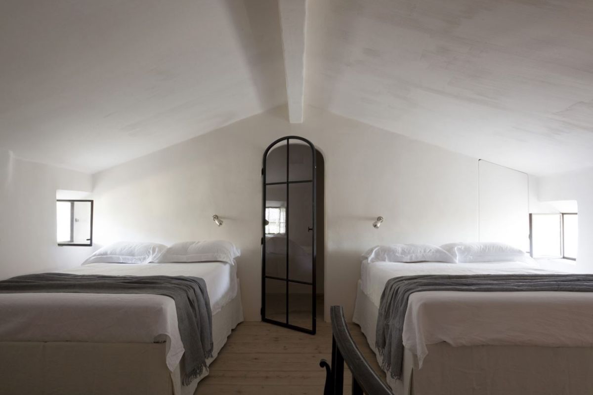 Provence bedroom decor with white walls and shared beds