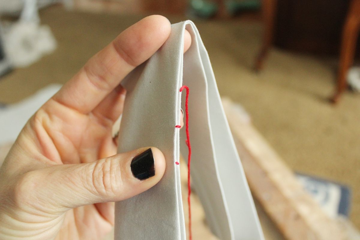 Pull the whole needle and thread out