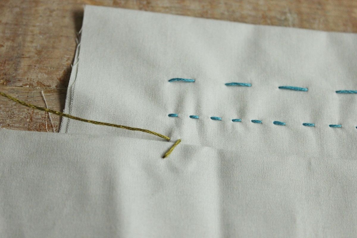 Pull the whole needle and thread up