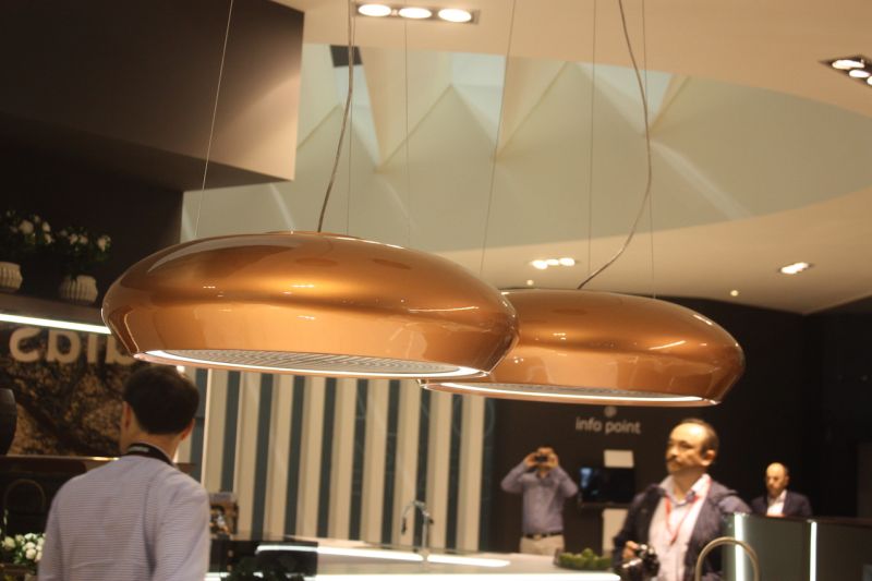 Similarly, jdias used a pair of these gold range hoods as kitchen island lighting.