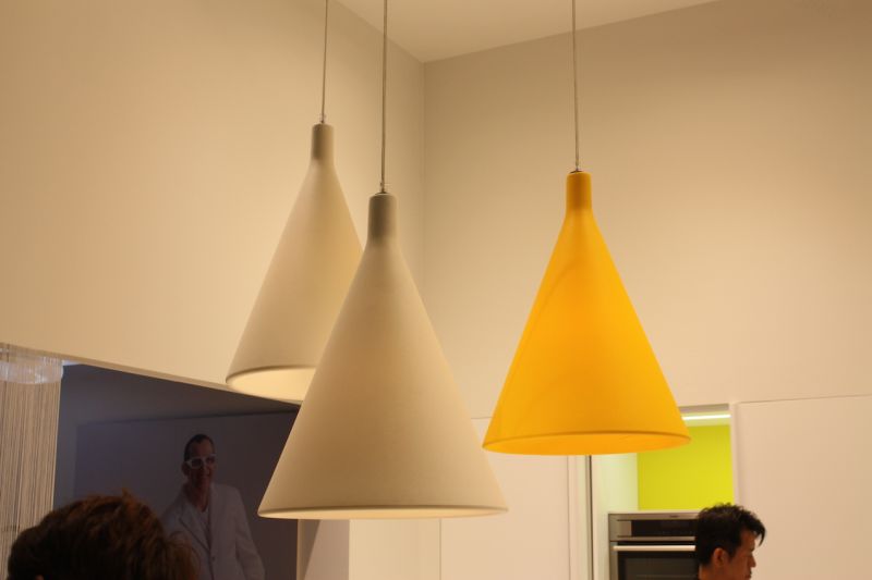 Every kitchen design can use a pop of color and that's what you get with these funnel-shaped kitchen pendant lighting fixtures. Rational Kitchen showed these as part of a modern kitchen decor.