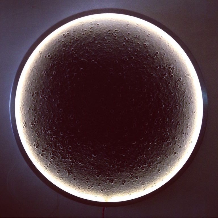 It is made from a spun aluminium frame and handmade paper drum.