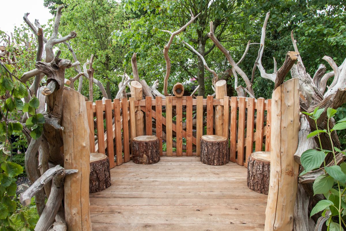 You can repurpose tree stumps as stools and fallen tree trunks can be used as fence poles or decorations