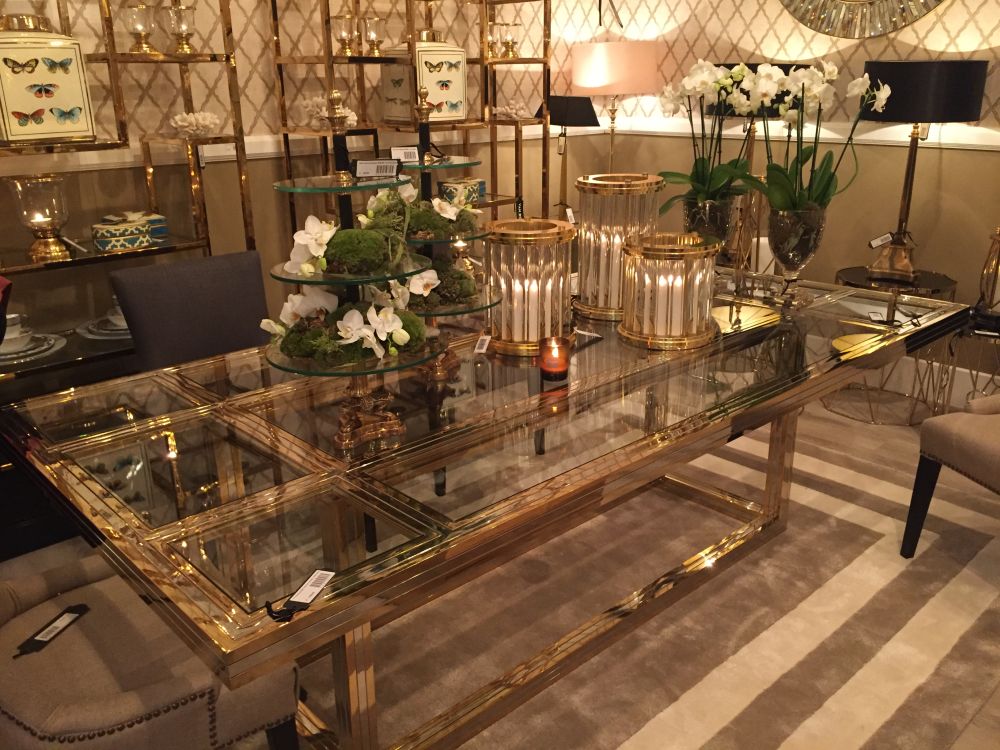 Rectangular dining table with glass top and gold frame