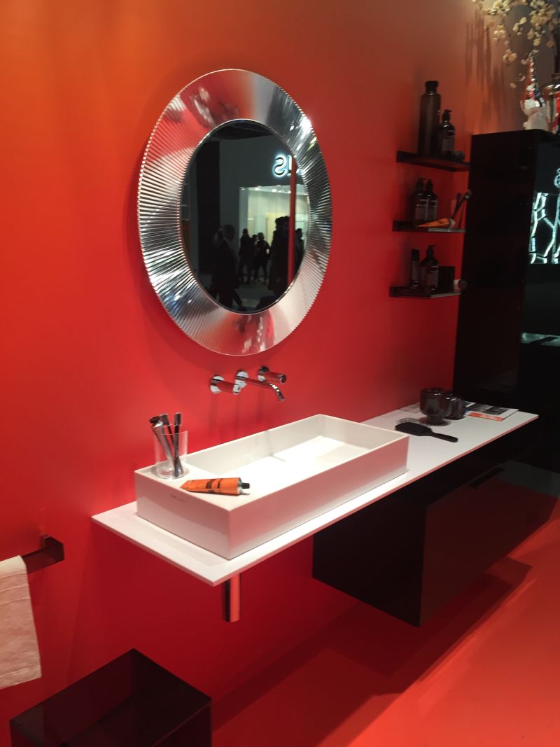 Red wall for bathroom with a cool mirror
