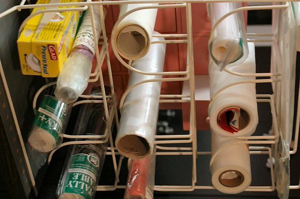 Reorganize Your Plastic Wrap Drawer With A Wine Rack