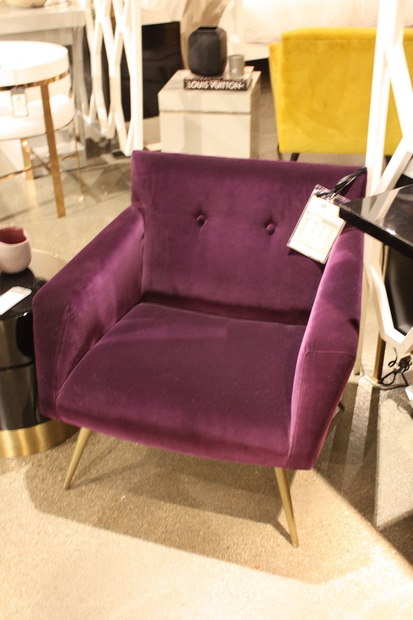 Pick a rich color like this plum velvet armchair from Resource Decor.