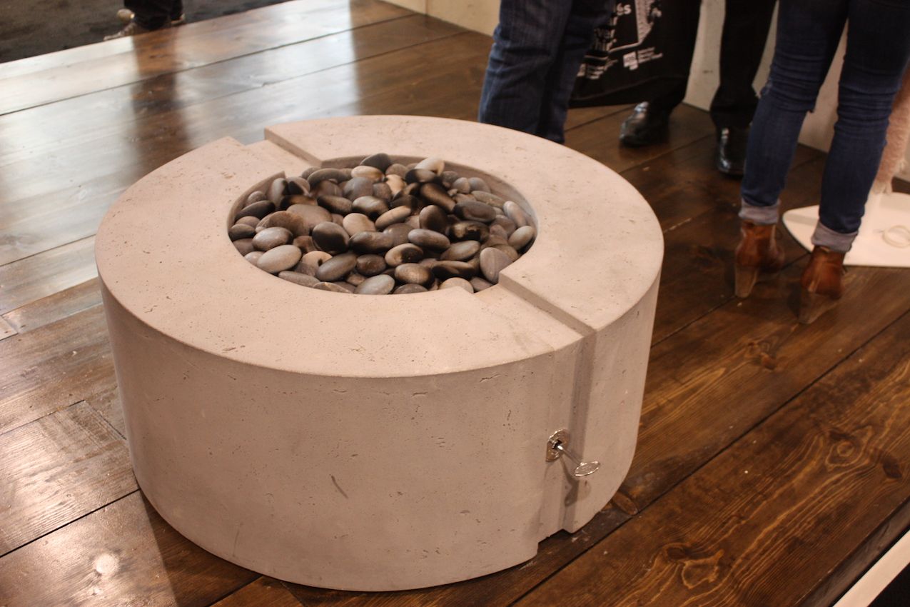 Outdoor fire pits are not losing popularity either and this concrete model from DEK is super stylish.