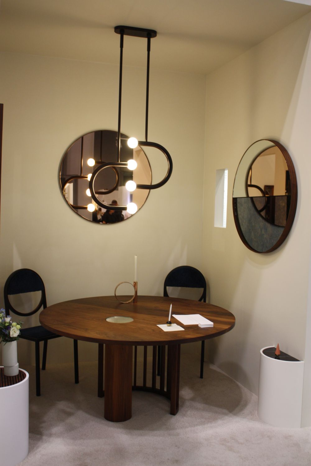 Round dining area decorated with mirrors