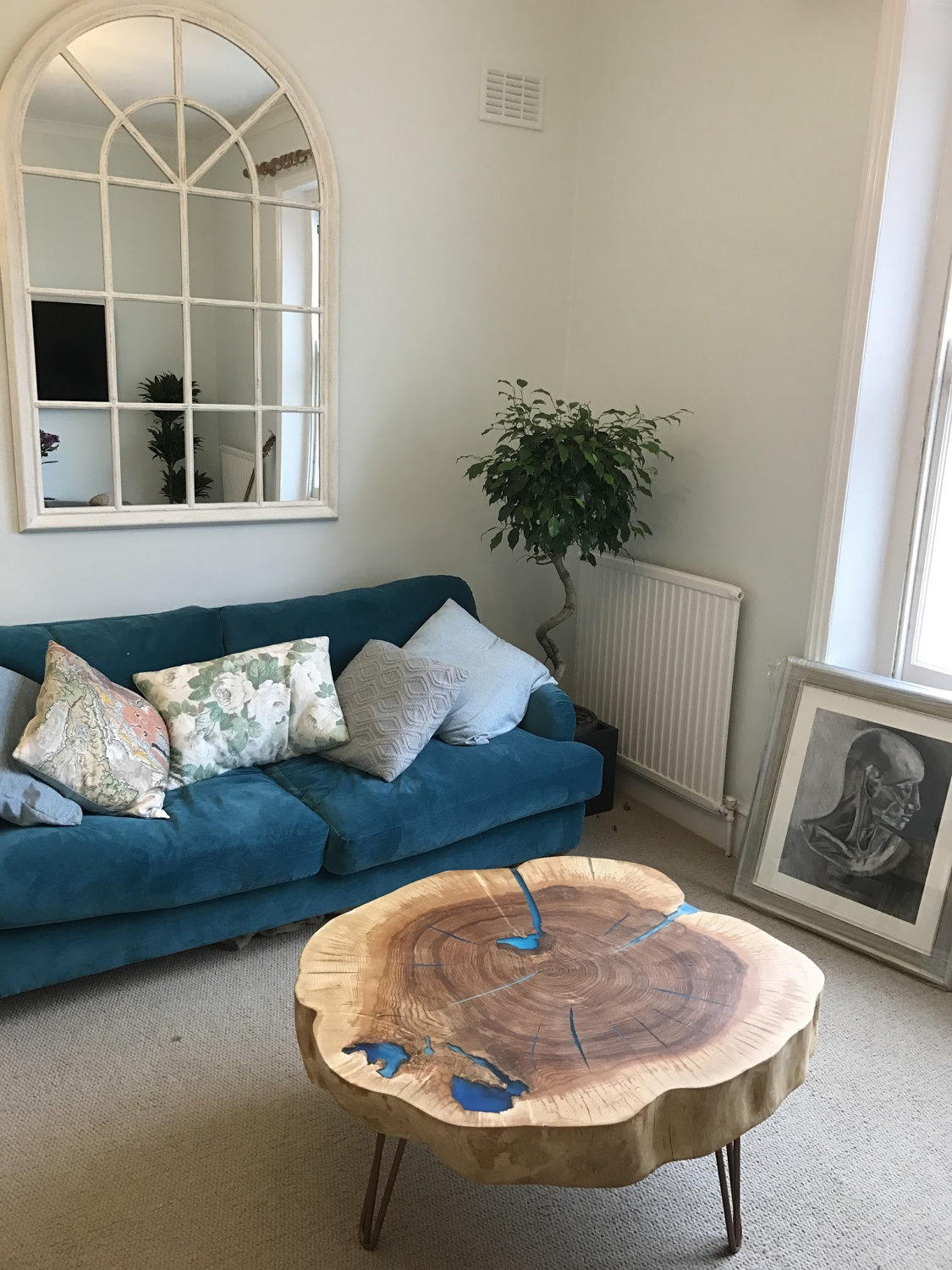 Round live edge coffee table with resin and hair pin legs