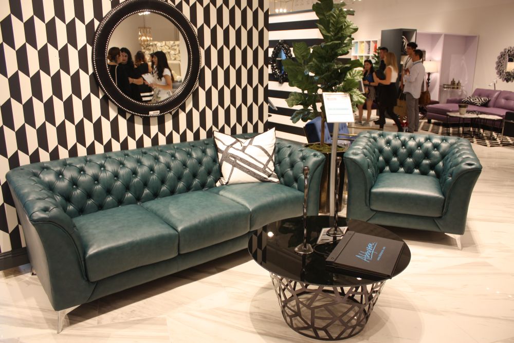 Round mirror above the sofa