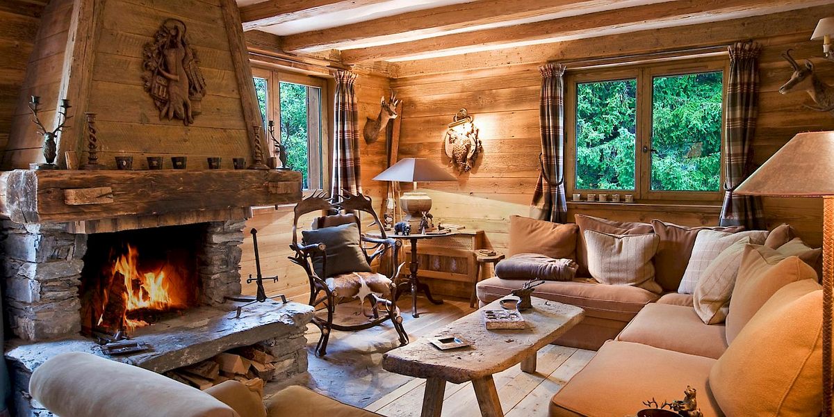 Rustic alpine interior design with stone stacked fireplace