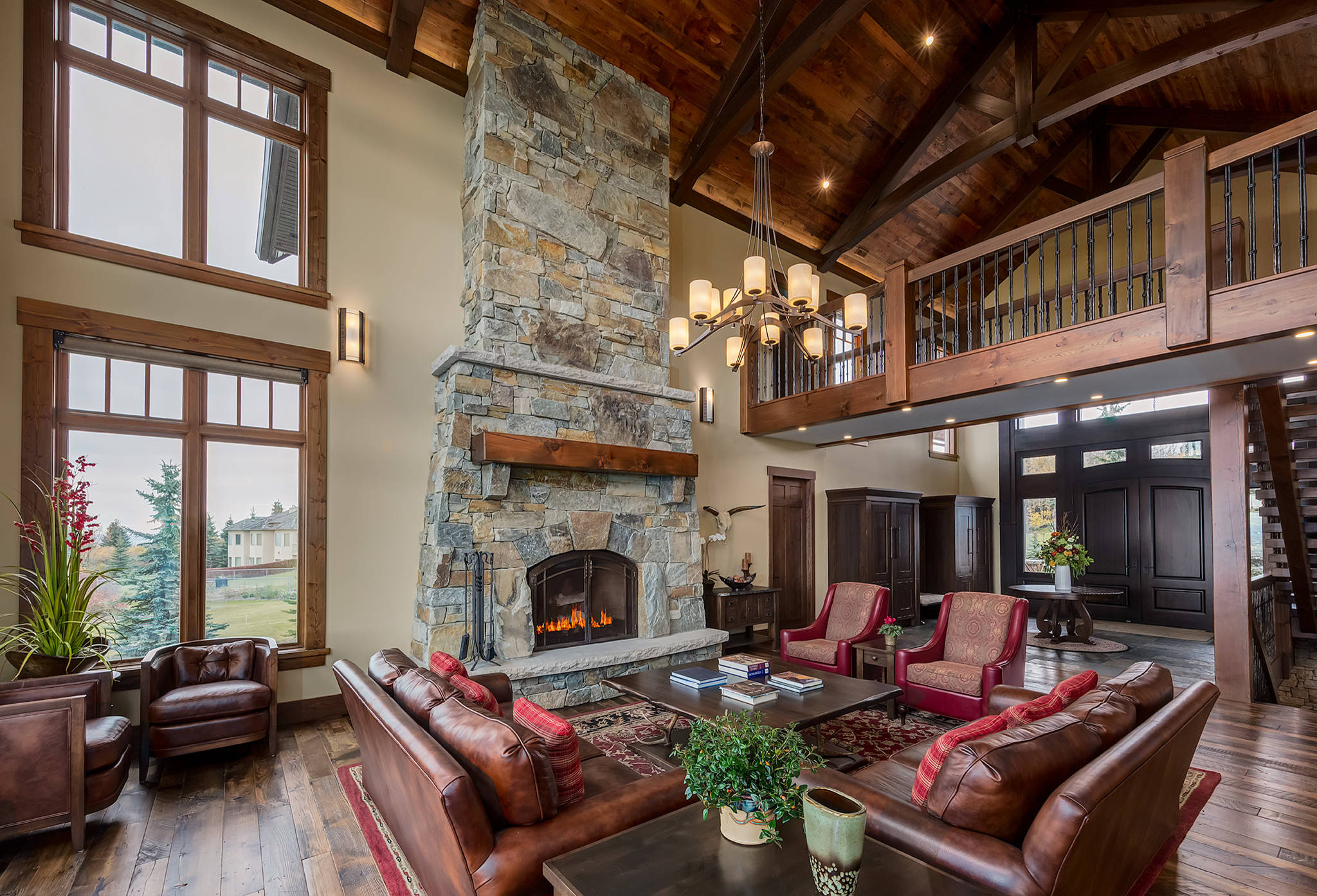 Rustic craftsman living room stone fireplace two story