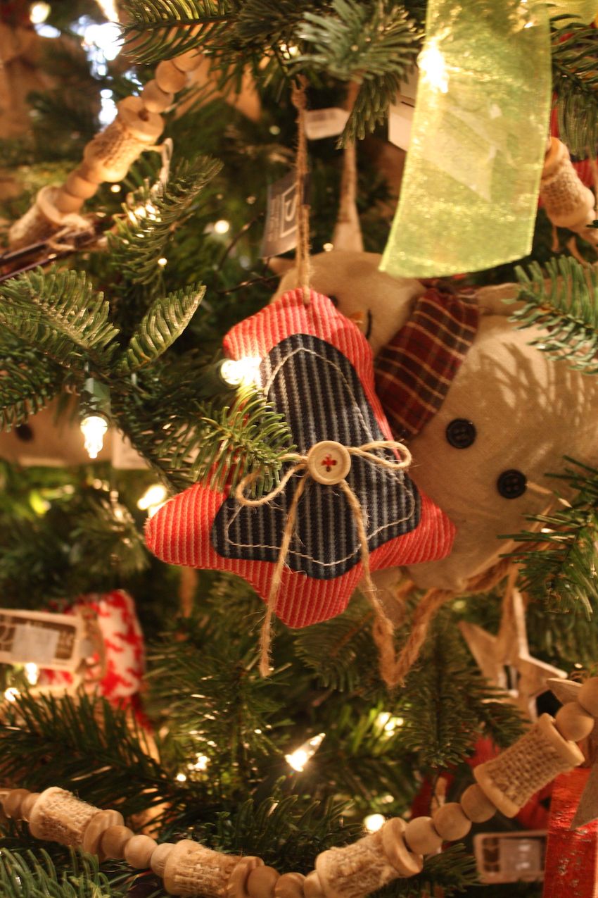 Simple stuffed ornaments, embellished with twine and a single button, are rustic.