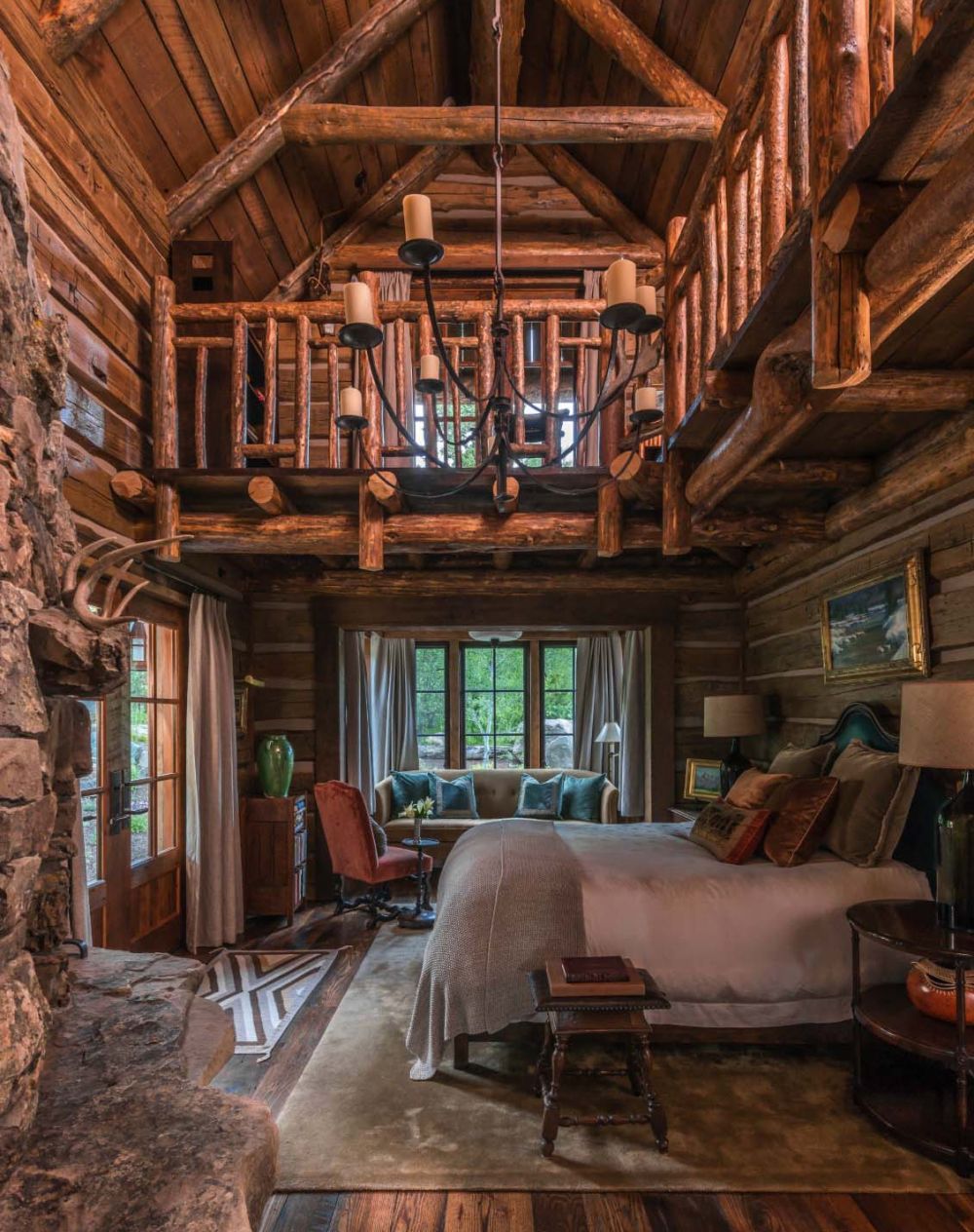 An interior balcony makes the master bedroom light and airy.