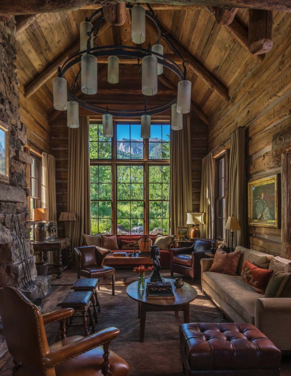 The pitched ceiling highlights the tall window and the view beyond.
