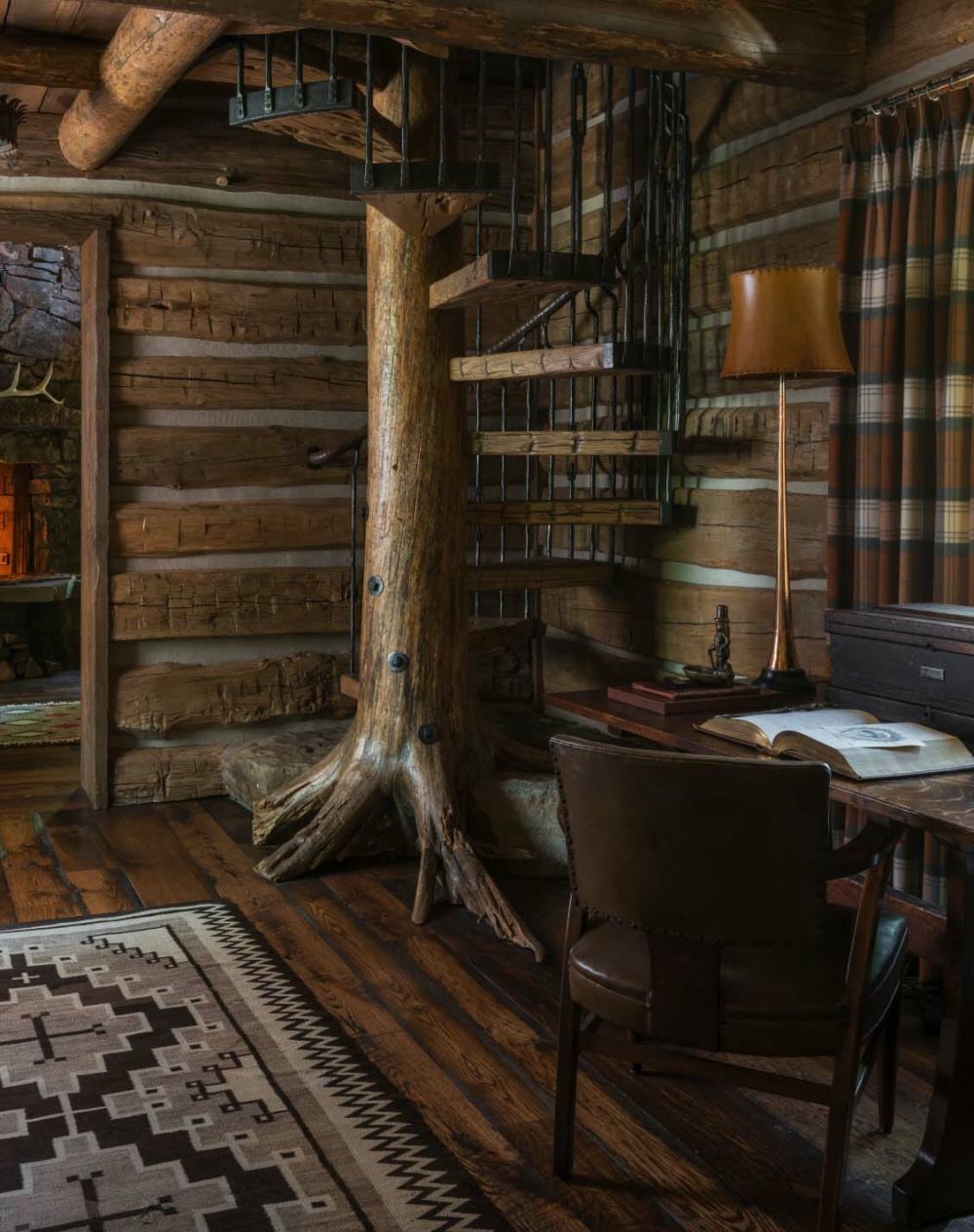 Rustic mountain residence in in Teton Valley Wyoming spiral staircase
