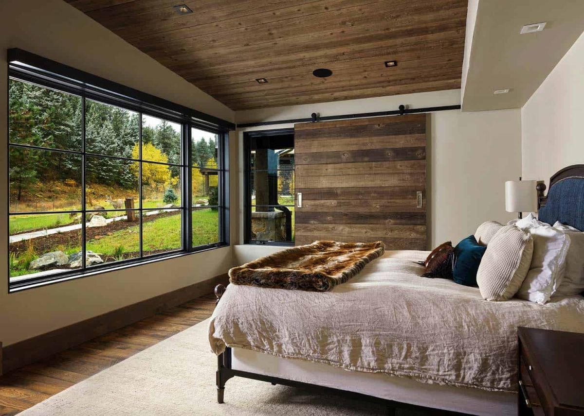 Rustic ranch in Colorado bedroom barn door