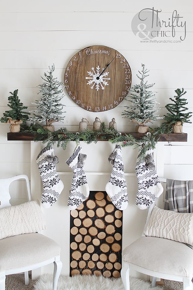 A wood clock advent calendar above the mantel