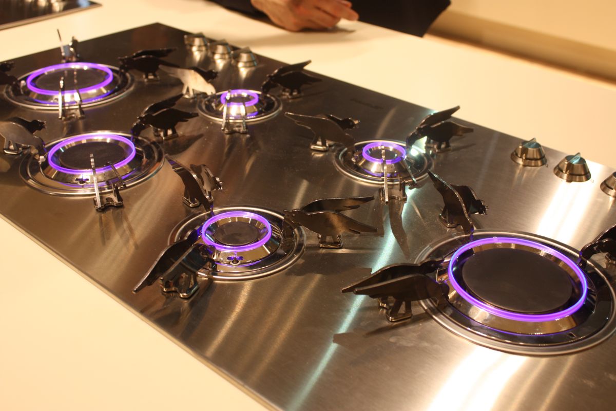 SMEG showed this style of cooktop. While it is contained in a specific stainless steel-covered area, it's still a sleeker version of the usual has stove. All the burner pieces, are removable for easy cleaning. The most unusual part of the design is the bird-shaped support, which are also available in other designs.