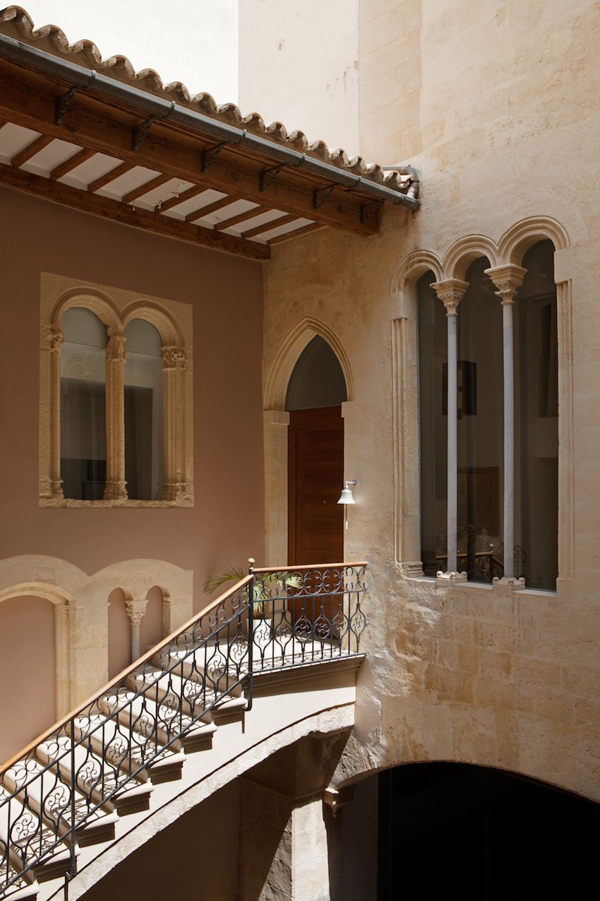 Gorgeous wrought iron railings run the length of the staircase.