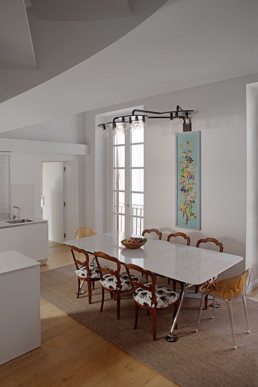 Whimsical fabric on the chairs adds a light touch to the kitchen dining space.